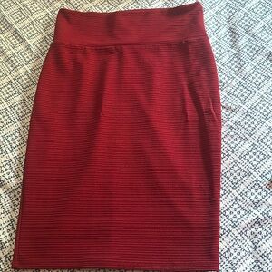Burgundy pencil skirt can be wore with a crop top or any type of shirt.